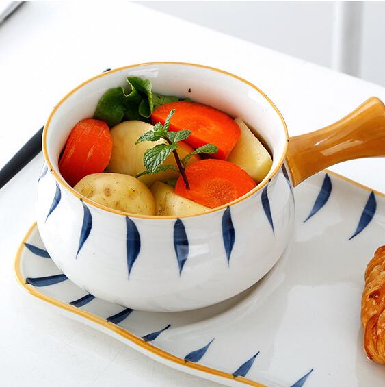Ceramic bowl with vegetables on a matching plate